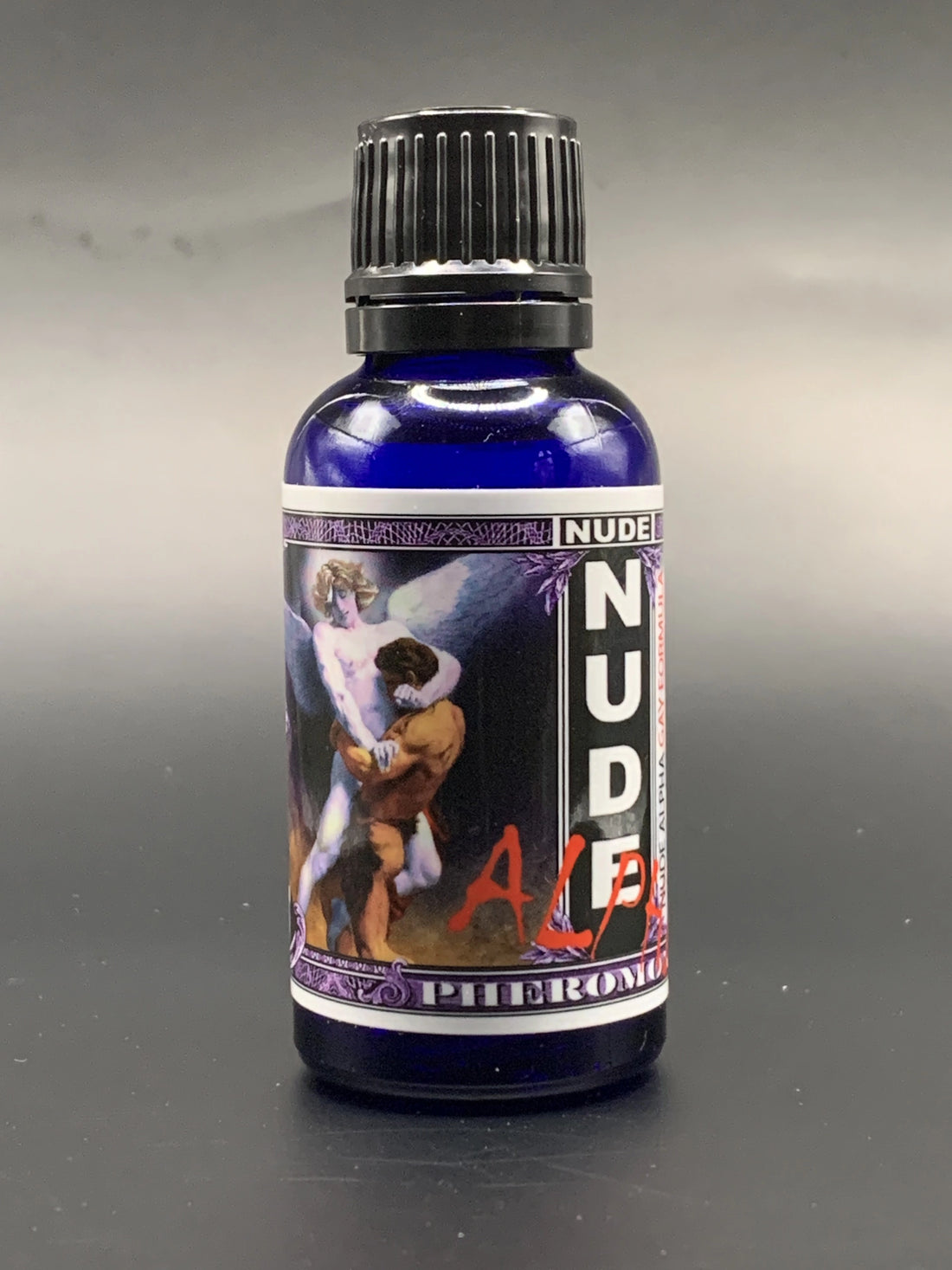 Bottle labeled 'NUDE' with a colorful label featuring graphics on a white background