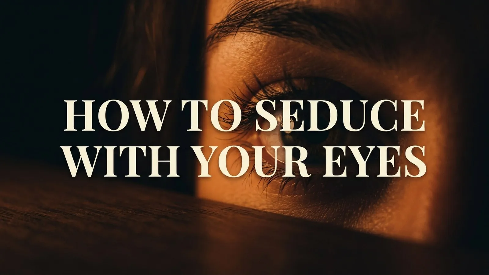 How to seduce with your eyes: dramatic close-up of an eye lit by warm amber light
