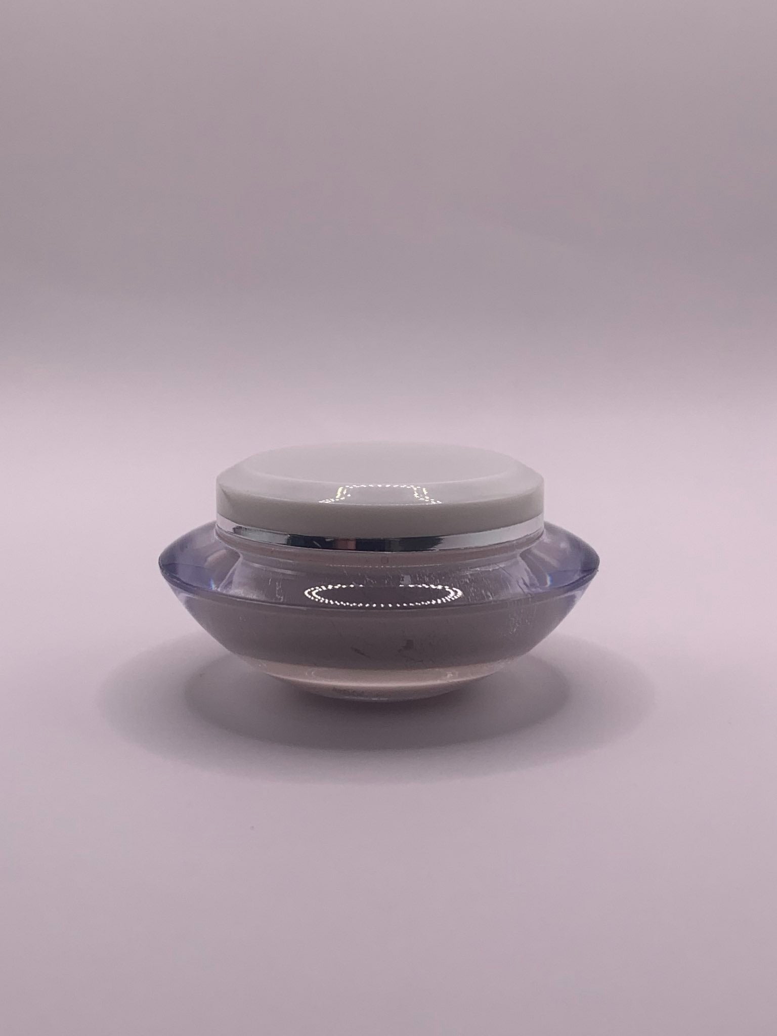 Pheromone Perfume with Copulins Solid Cream Parfum container white and oval shaped. 