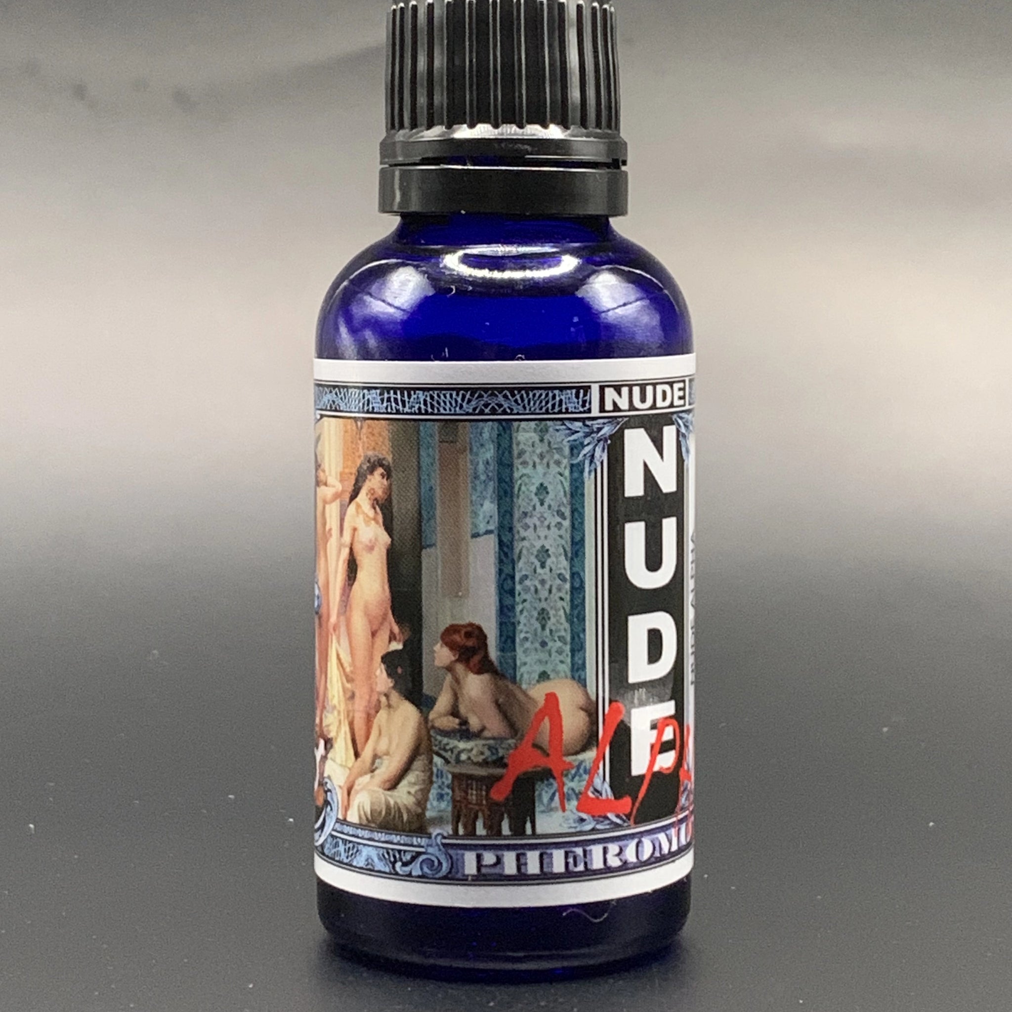 bottle of nude alpha pheromone oil for men to attract women. 