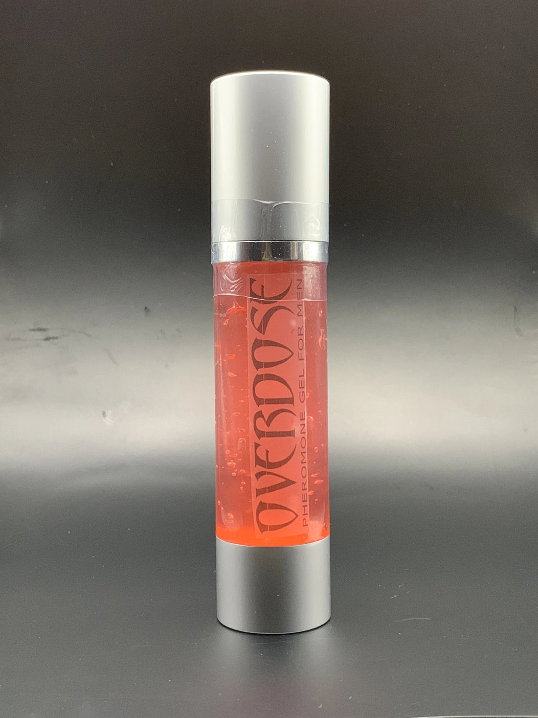Bottle of red gel with label OVERDOSE PHEROMONE GEL printed on it