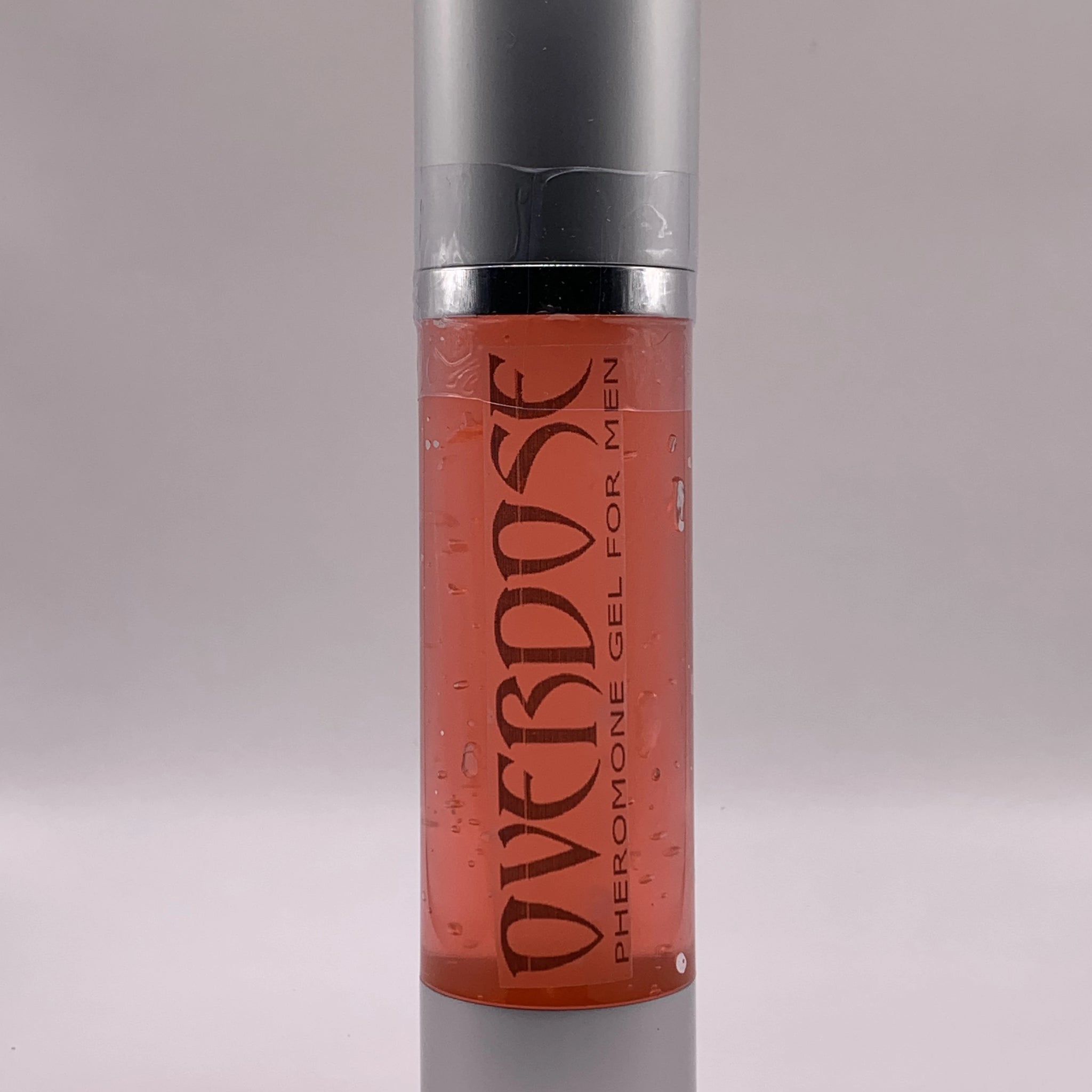 Bottle of red gel with label OVERDOSE PHEROMONE GEL printed on it