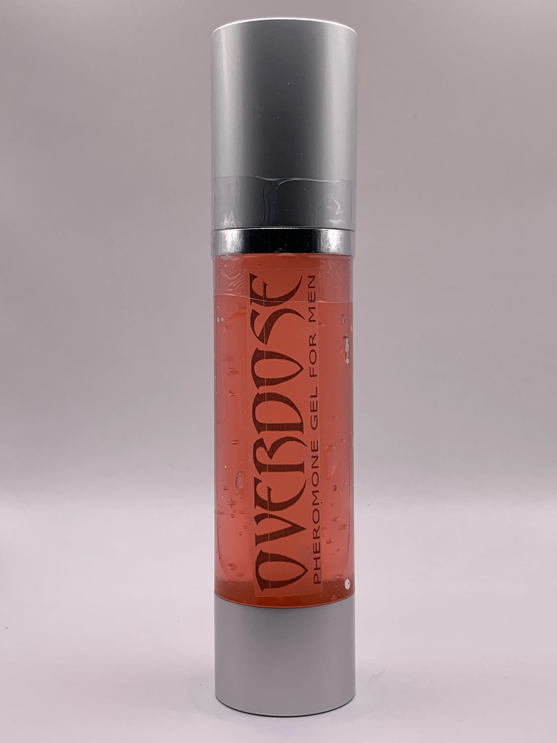 Bottle of red gel with label OVERDOSE PHEROMONE GEL printed on it