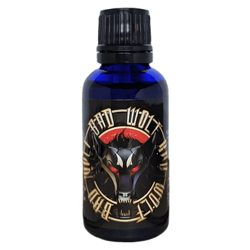 Bad Wolf Pheromone Oil  blue bottle with packaging of artistic picture of wolf and a blue cap.