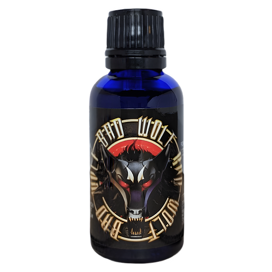 Bad Wolf Pheromone Oil by Liquid Alchemy Labs in a blue bottle with a fierce wolf design on the label, part of the Royal Pheromones line, designed for a bold and alpha presence; ideal for those seeking Pheromone Perfumes, Pheromone Oil, or Pheromone Colognes.