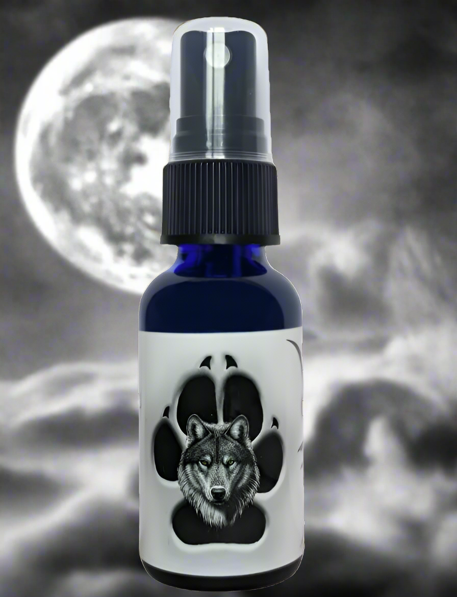 A dark blue pheromone spray bottle featuring a wolf's face inside a paw print.